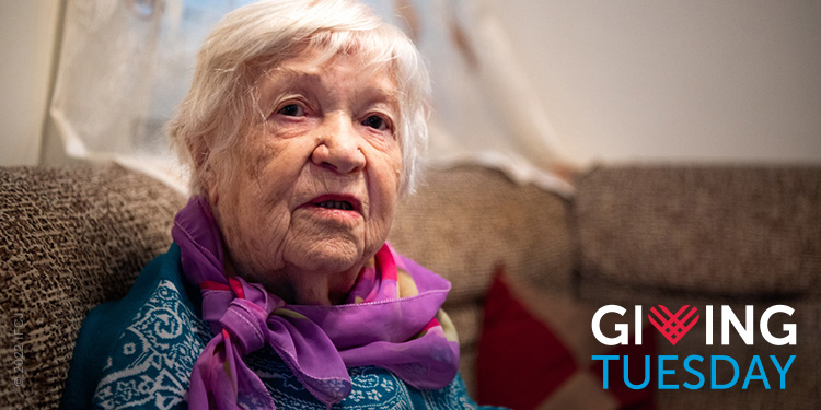 Give to IFCJ on Giving Tuesday. Elderly Jewish woman wearing scarf