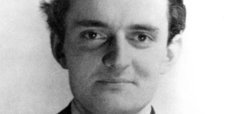 Black and white headshot of a man.