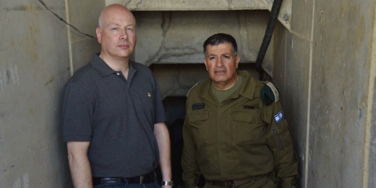 Man standing next to an IDF soldier.