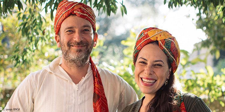 Yael Eckstein and her husband smiling together.