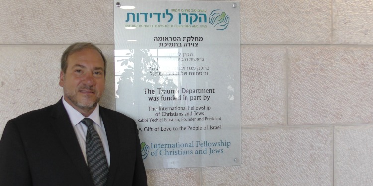 Rabbi Eckstein standing in front of the hospital trauma unit IFCJ funded.