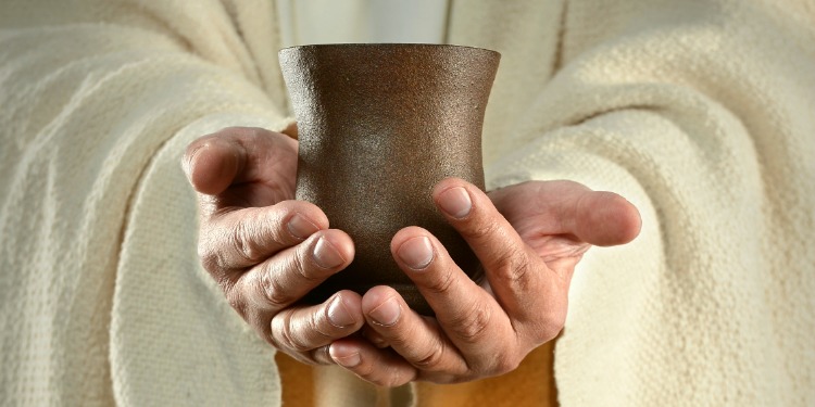 hands holding cup - download bible study on suffering