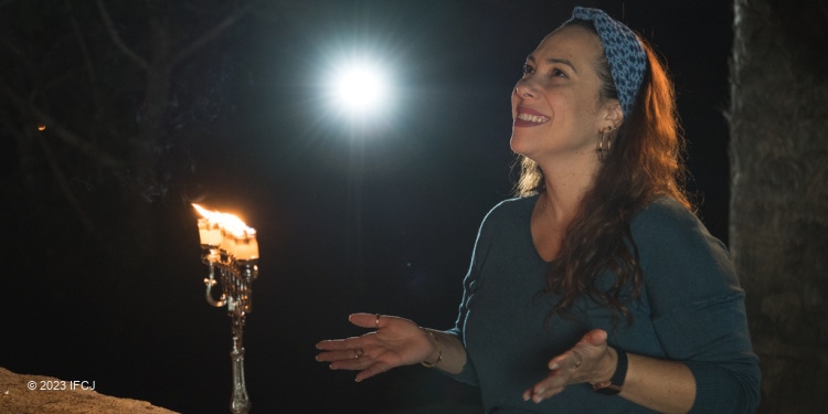 Yael Eckstein with Hanukkah menorah
