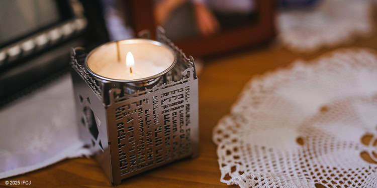 Holocaust candle sitting on a table
