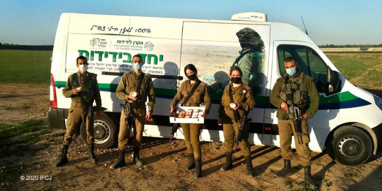 IDF soldiers celebrate Hanukkah with Fellowship vehicle