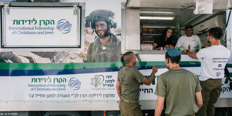 People being fed at an IFCJ food truck.