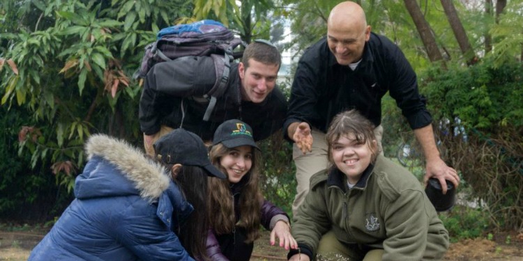 A group of IDF soldiers with disabilities celebrating Tu B'Shvat.