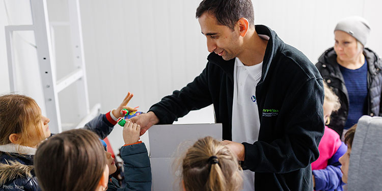 IFCJ employee with a group of children