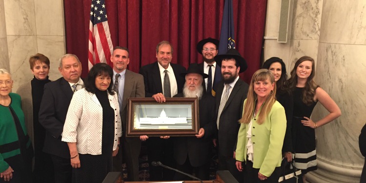 Rabbi Eckstein standing with 11 others as he's honored for Jewish Heritage Month.