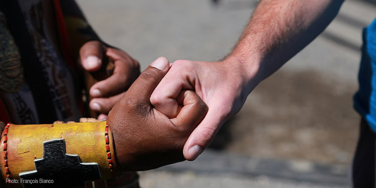 two people engaging in a fist bump, representing unity and friendship