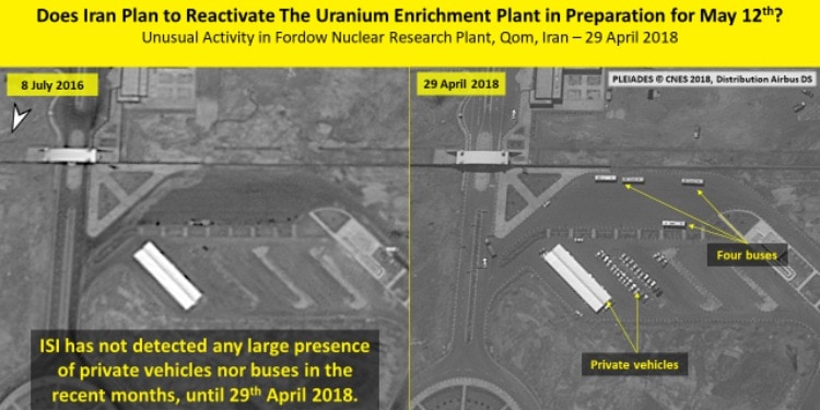 Aerial view of a nuclear research plant in Iran with the buses and private vehicles pointed out.