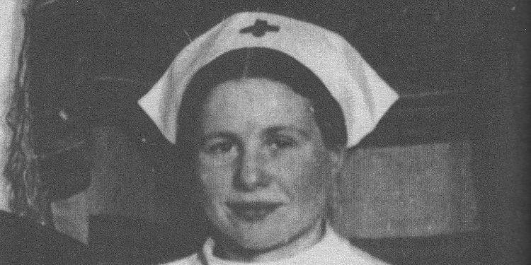 Black and white image of woman wearing white nurses hat with cross on the front.