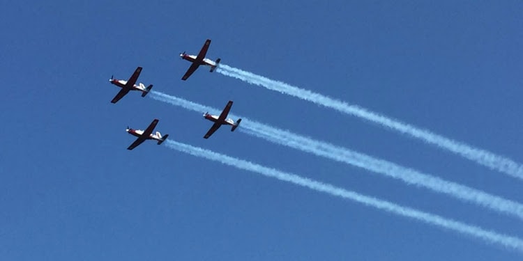 Four Israeli Air Force planes flying in the sky.