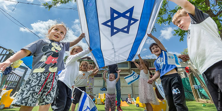 Israeli children play with Israeli flags