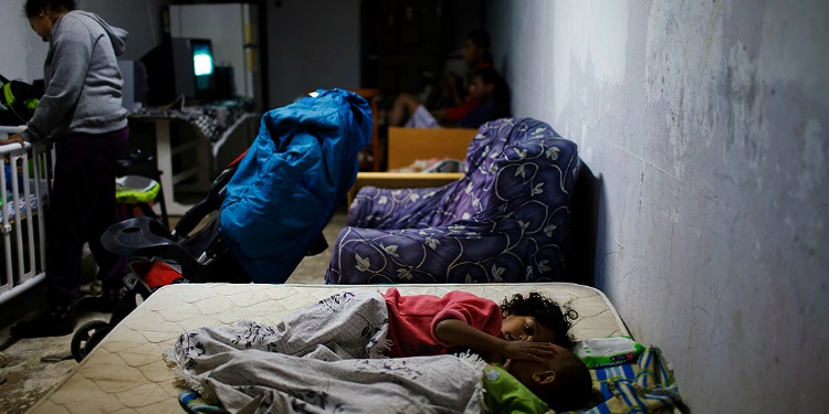 Israeli family sleeps in a bomb shelter