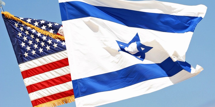 Israeli flag waving on top of the American flag.
