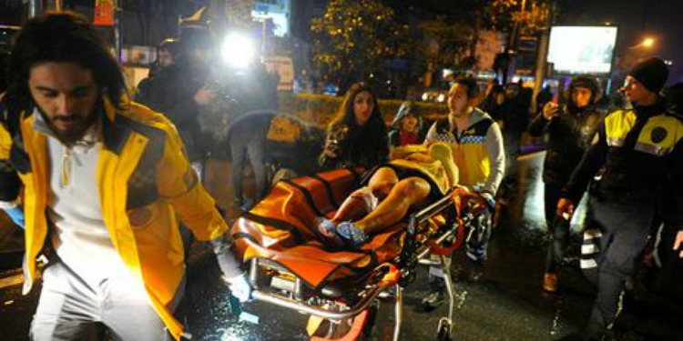 Several medics rolling an injured person on a stretcher from a terror attack in Istanbul.