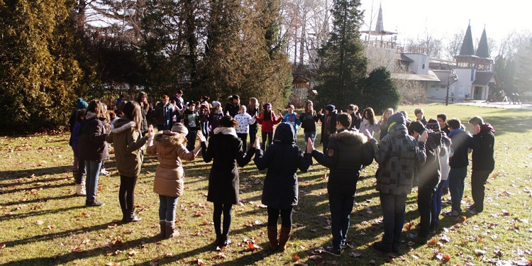 group of people standing in unity