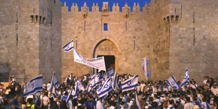 Waving Israeli flags at Western Wall