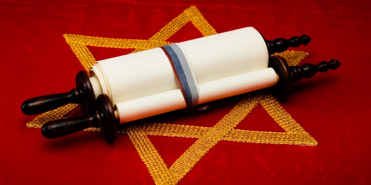 A Jewish scroll on a Star of David cloth.