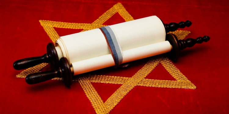 A Jewish scroll on a Star of David cloth.