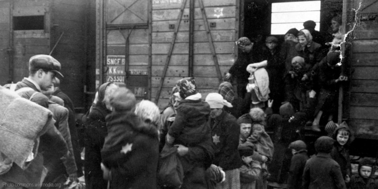 Jews being unloaded from a cattle car at Auschwitz-Birkenau, May 1944 during the Holocaust