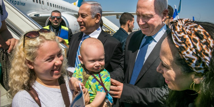 Yael Eckstein greeting families making Aliyah to Israel as they exit a Freedom Flight