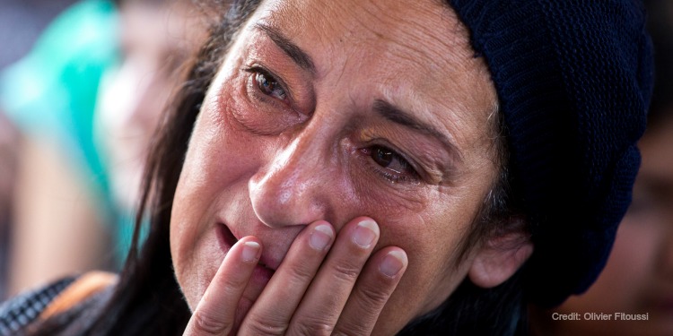 Jewish woman crying tears of relief after being rescued from anti-Semitism