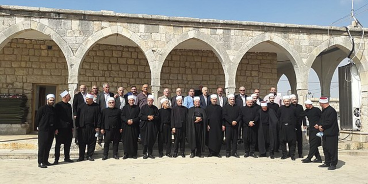 Druze standing outside of the Khalwat (prayer house)