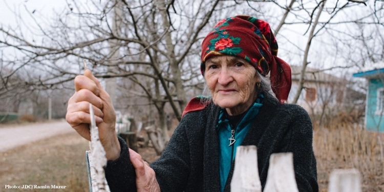 Larisa, elderly Jewish woman outside in the cold