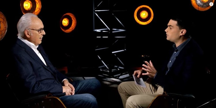 Ben Shapiro and MacArthur on set talking about Christianity.