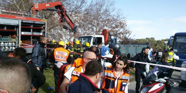 Several medics and firemen responding to wounded soldiers.