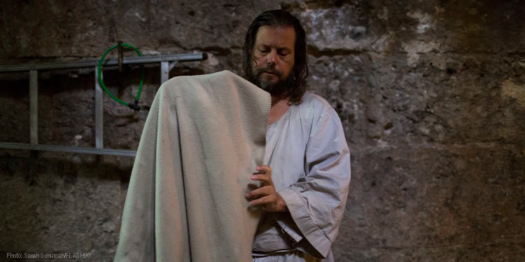 Man holding a blanket