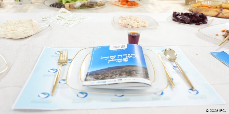 Passover 2026 celebration table with traditional foods, wine, and festive decorations for Passover observance.