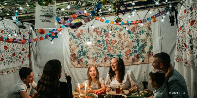 Eckstein family in sukkah for Sukkot