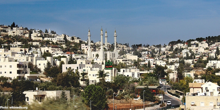 View of many white buildings in modern day Israel.