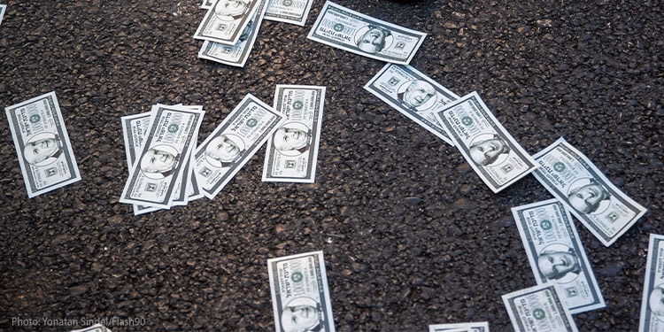 Money bills laying on the ground