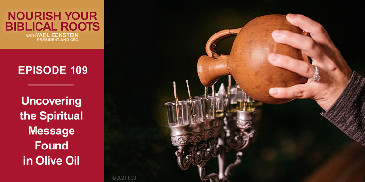 Image of Yael pouring oil in a menorah