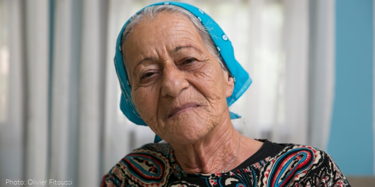 Elderly jewish woman wearing blue scarf on head
