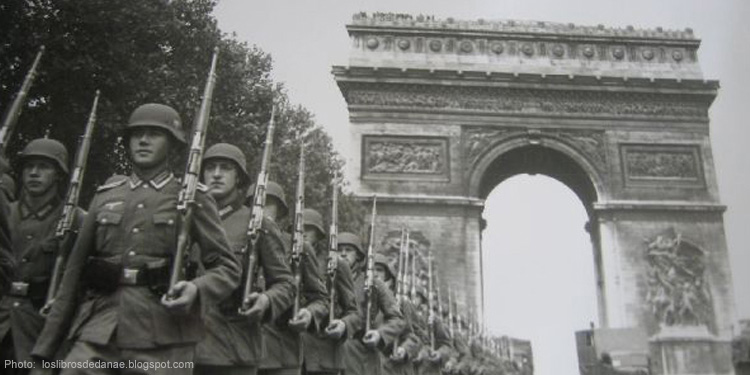 Black and white image of Nazis marching through Paris.
