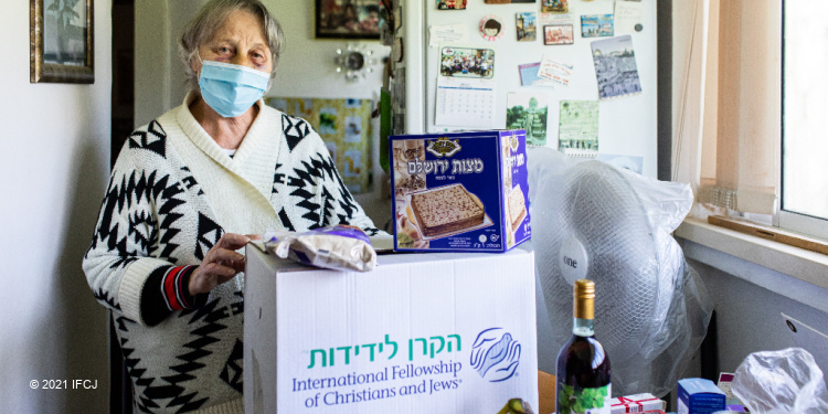Ninel, a widow in Israel receiving a Passover food box