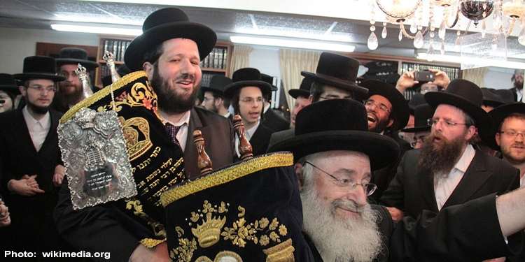 Jewish men celebrate during Simchat Torah