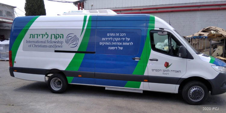 Mobile service vehicle providing support to elderly refugees in Dimona.