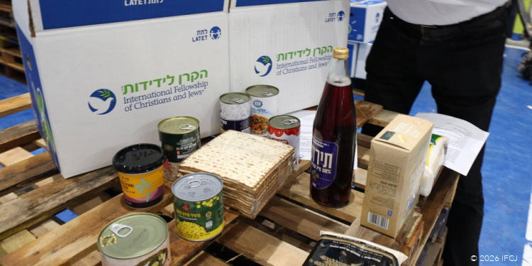 Passover food boxes and activity kits from Latet, including canned goods, matzah, and educational materials, supporting families during Passover celebrations.