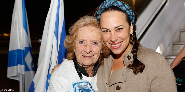 Yael with elderly woman at Ben Gurion International Airport
