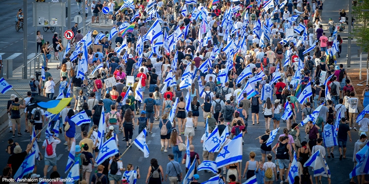 People attend a protest against the judicial overhaul in Tel Aviv