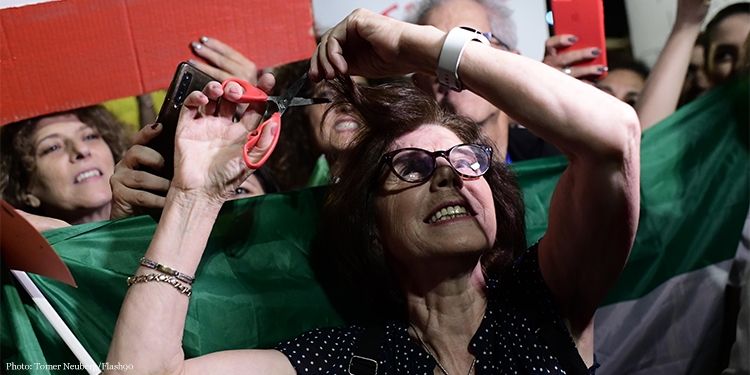 People protest the killing of Mahsa Jina Amini and in support with the Iranian people, in Tel Aviv.