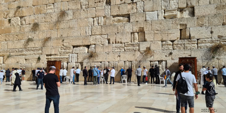 Michael Seiler (IFCJ Staff) taking donors' prayers to the Western Wall.