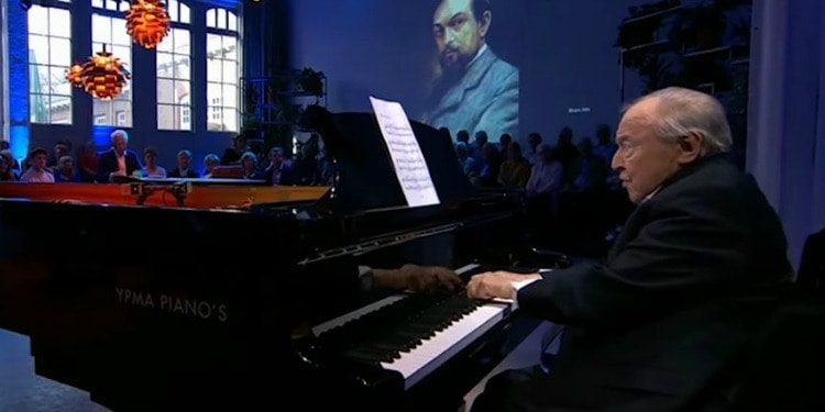 Man playing the piano at an event.
