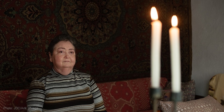 elderly woman sitting on couch
